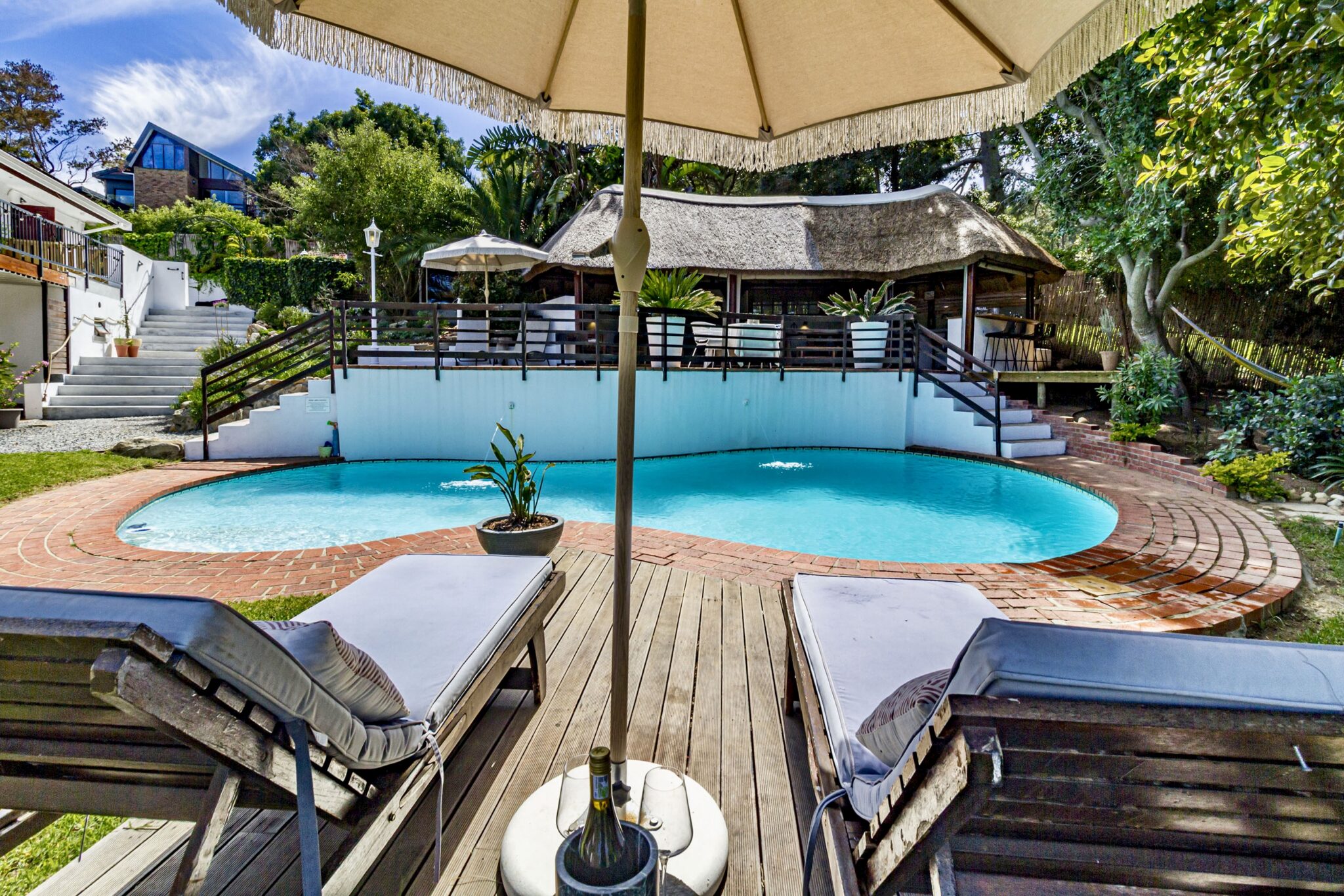 The ideal stay for a Cape Winelands wedding: relaxing by the pool at Villa Helderberg