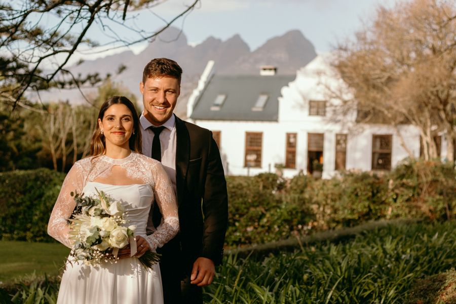 Cape Winelands wedding venues: a bride and groom at Vredenburg Manor House